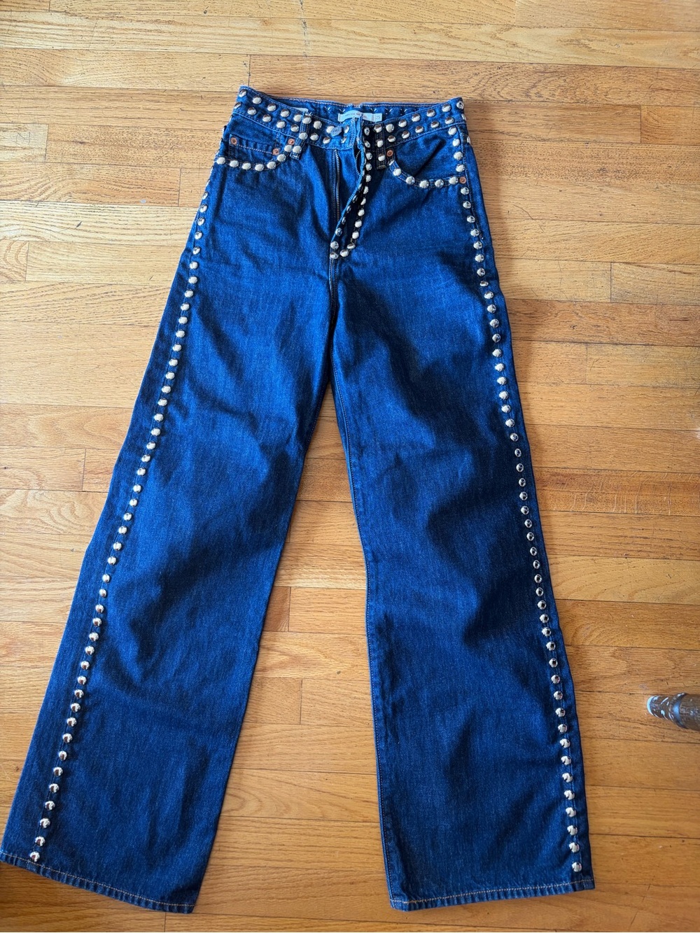 Upcycled studded Levis high rise ribcage jeans.
